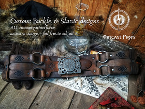 Decorative leather belt with intricate design on a rustic wooden background, featuring Outcast Props branding. Adventurer Leather Belt for LARP, Pirate Belt, Alchemist Belt, Medieval Belt, Fantasy, Steampunk, Wide Leather Belt, Adjustable Belt
