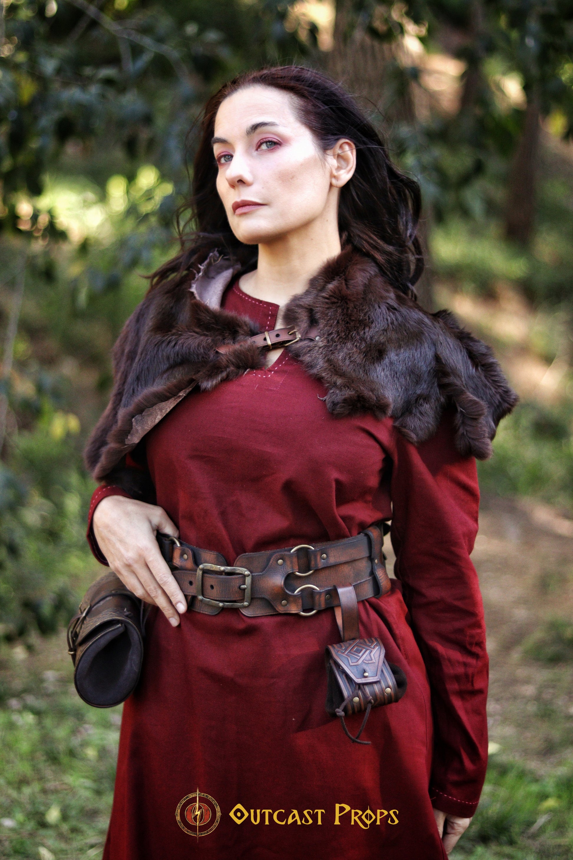 LARP adventurer outfit featuring a fur shoulder mantle, red medieval dress, and the adjustable leather belt with two pouches. This handmade fantasy belt is perfect for immersive role-playing, allowing you to carry tools, scrolls, and healing potions securely. The adventurer leather belt for steampunk and medieval cosplay fits over armor or robes, adding a rugged, authentic touch to your costume ensemble.