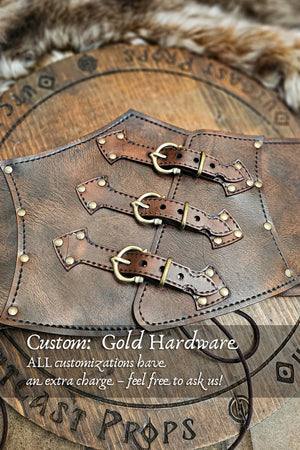 Aged brown leather underbust corset with custom golden brass hardware, handcrafted by Outcast Props. This witch corset features three buckle straps and decorative rivets, ideal for steampunk waist cincher, ren faire costume, and gothic festival outfit. Made from premium vegetable-tanned leather with artisan aging techniques, available upon request as a customization option for fantasy or LARP corsets.