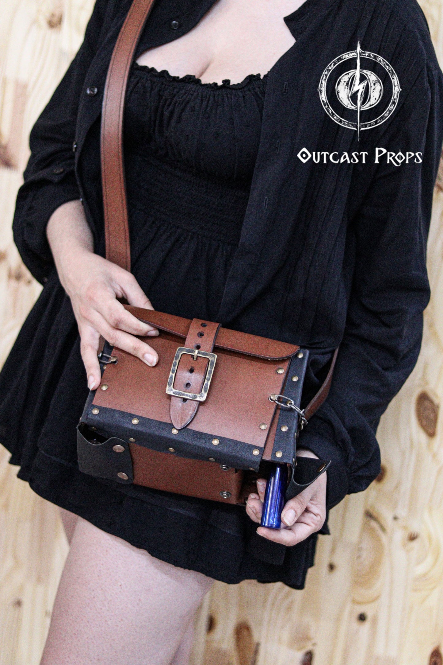 Alchemist leather larp Bag Potion Set for steampunk, alchemist costume, mage, witch, chef, healer or assassin cosplay. Natural Leather Bag. Person holding a brown leather bag with Outcast Props logo in the corner