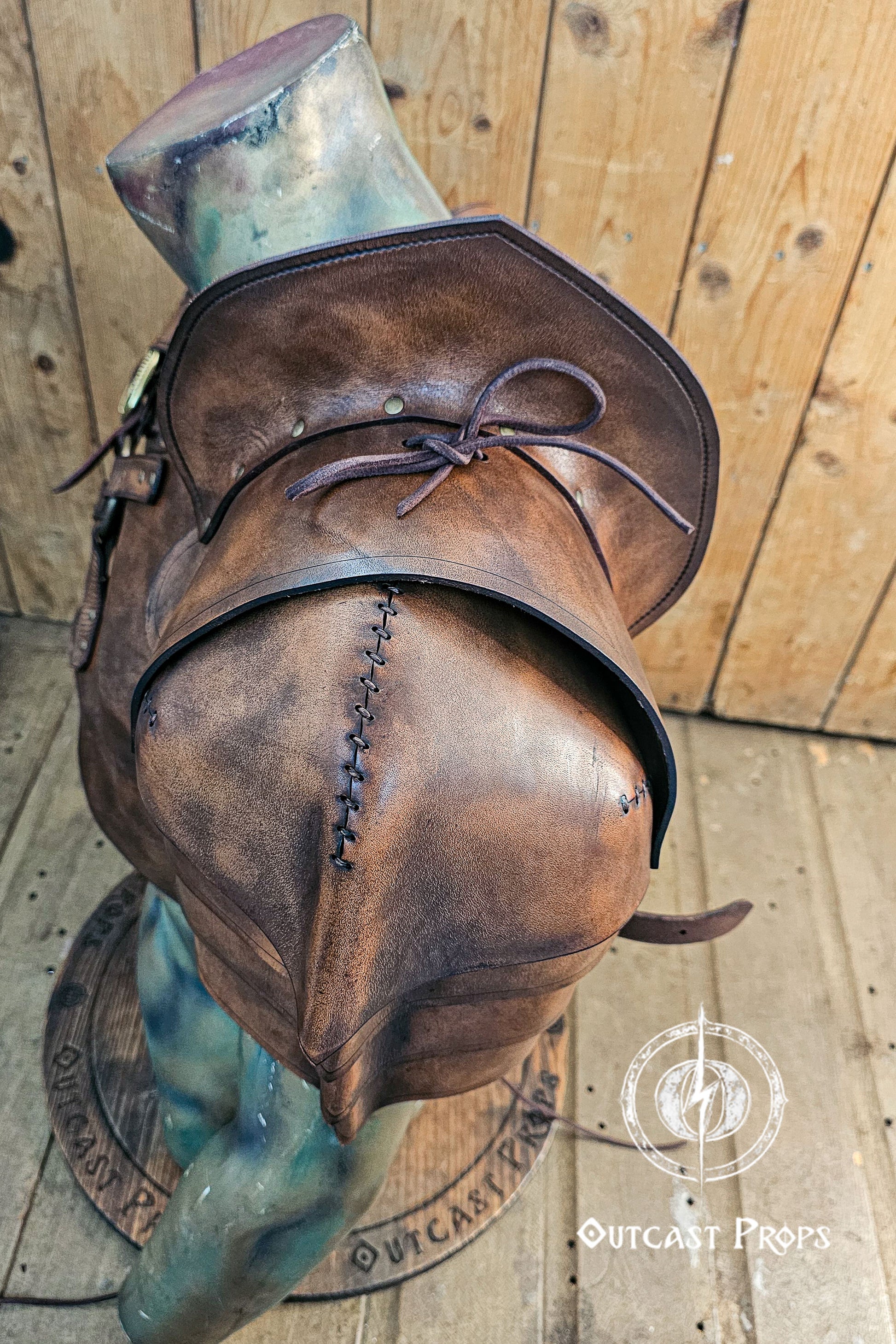Close-up of the shoulder and chest harness construction of the leather armor set, showing the quality of the vegetable-tanned leather and patina. The layered shoulder armor sits over the fur mantle, adding depth and realism. Visible straps, brass buckles, and weathered texture make it ideal for detailed larp costumes, fantasy warriors, or steampunk and tribal post-apocalyptic gear.