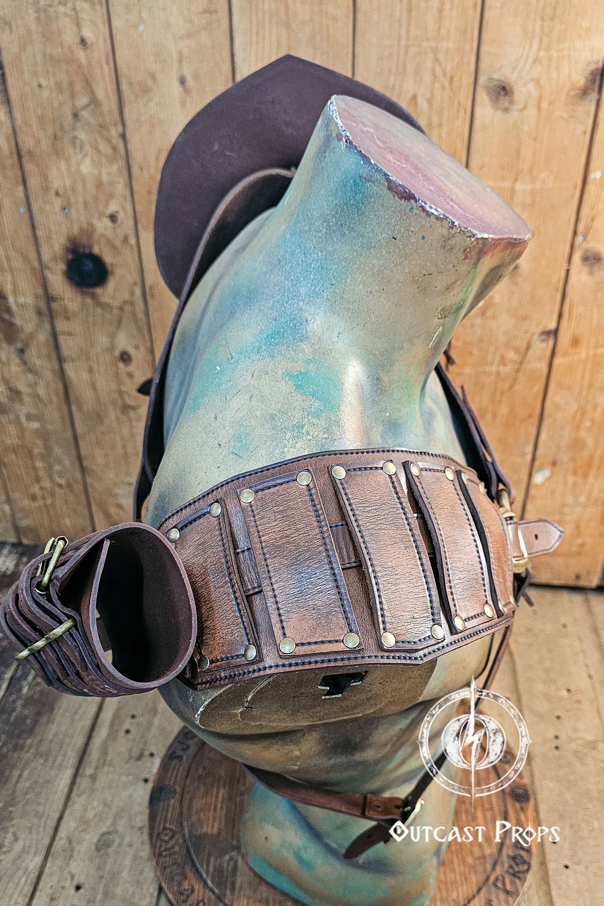Side angle highlighting the profile of the double shoulder armor set, with the fur mantle and sword sheath extending behind the wearer. The aged brown leather, riveted panels, and curved shape of the pauldrons suggest a handcrafted artisan piece. Great for larp viking warriors, barbarian armor cosplay, and realistic leather armor sets with fantasy aesthetics.