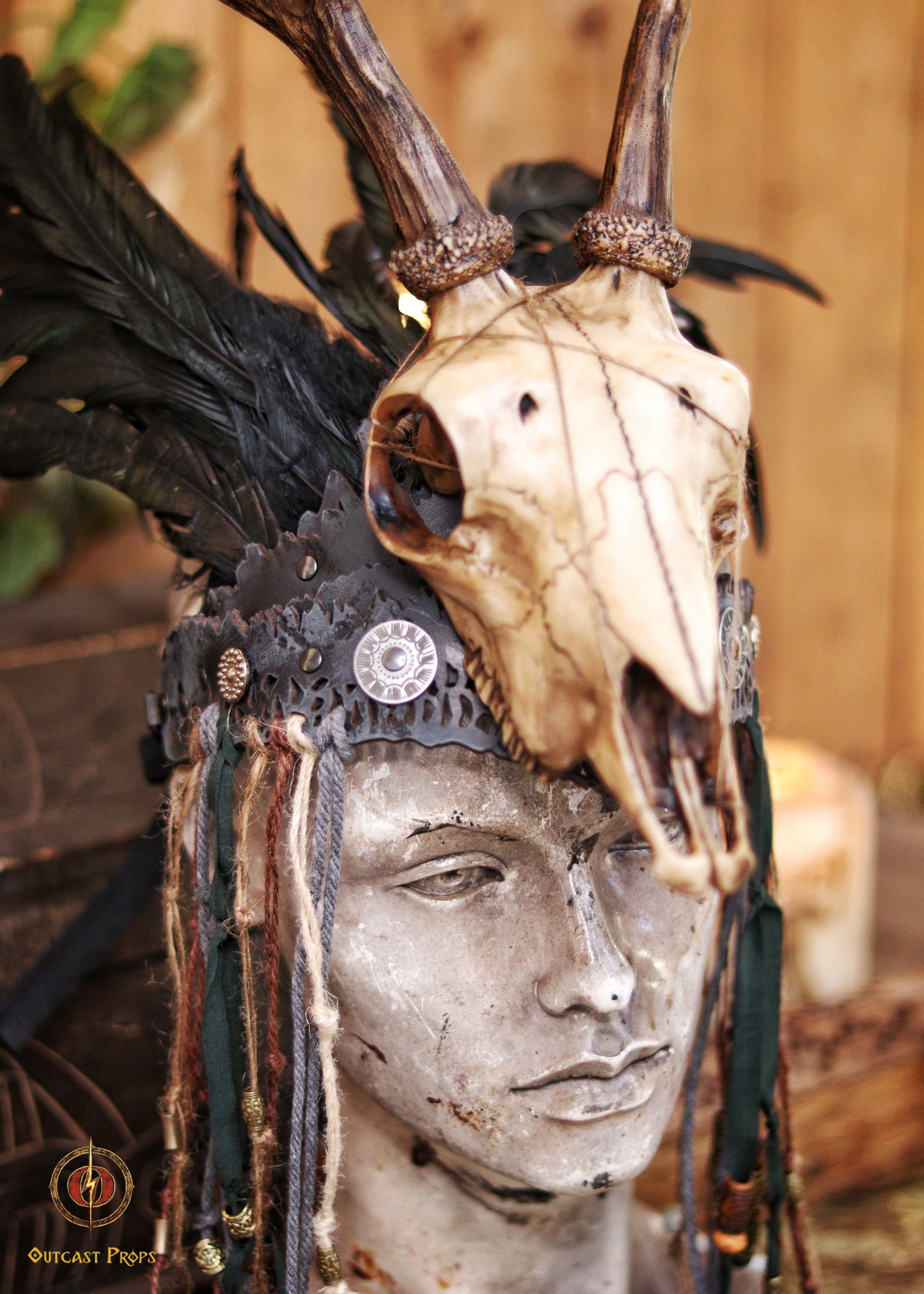 A Celtic adorned tiara with a resin skull, deer horns, feathers, bone pieces, beads, and fangs. Beltane Headpiece tribal deer horns skull and feathers tiara leather and resin