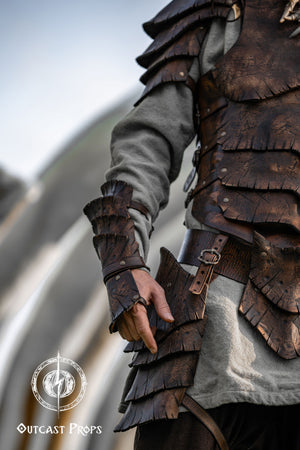 Dragon Scale Leather Bracer: LARP Cosplay Armor for Fantasy Warriors, Orcs, Archers - Handmade Medieval Costume Person wearing detailed leather armor with a blurred natural background