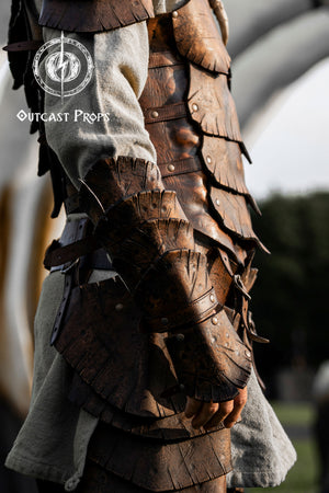 Dragon Scale Leather Bracer: LARP Cosplay Armor for Fantasy Warriors, Orcs, Archers - Handmade Medieval Costume Close-up of detailed leather armor with 'Outcast Props' logo.