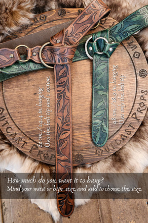Wooden belt with leather straps on a fur background