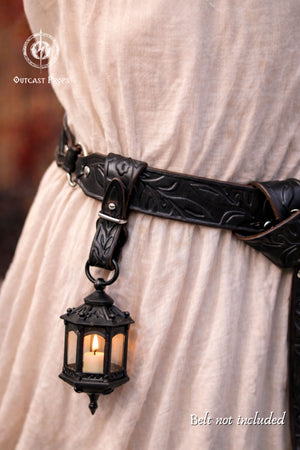 Decorative belt with a lantern pendant on a plain background