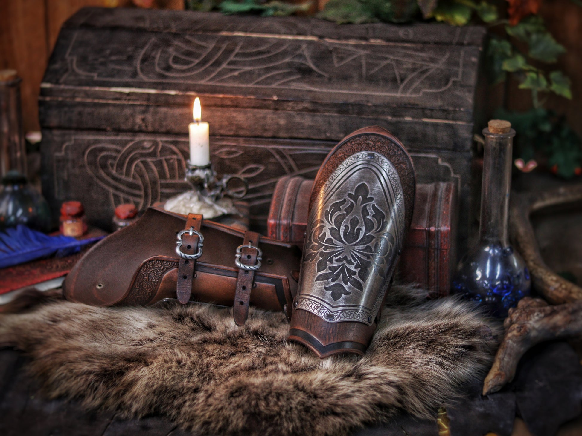 Artistic still life of fantasy bracers laid on fur with a candle-lit alchemist table. The engraved metal plates and rich leather textures make these medieval bracers ideal for noble warrior LARP outfits. A perfect accessory for immersive roleplay, fantasy photoshoots, or authentic-looking costume props.