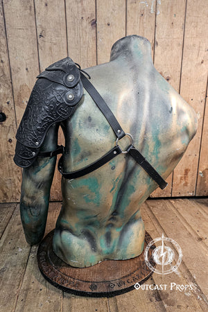 Leather arm guard on a mannequin bust against a wooden background. Leather Shoulder Pauldron: Musketeer Armor for LARP, Renaissance LARP, cosplay, Ren Faire accessory, Aramis inspired
