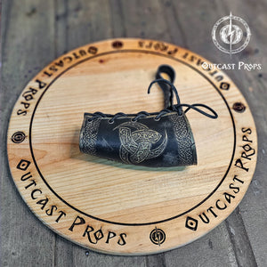 Odin Horns holder, viking horn holder made of leather belt horn holder. Decorative horn on a wooden board with 'Outcast Props' branding.