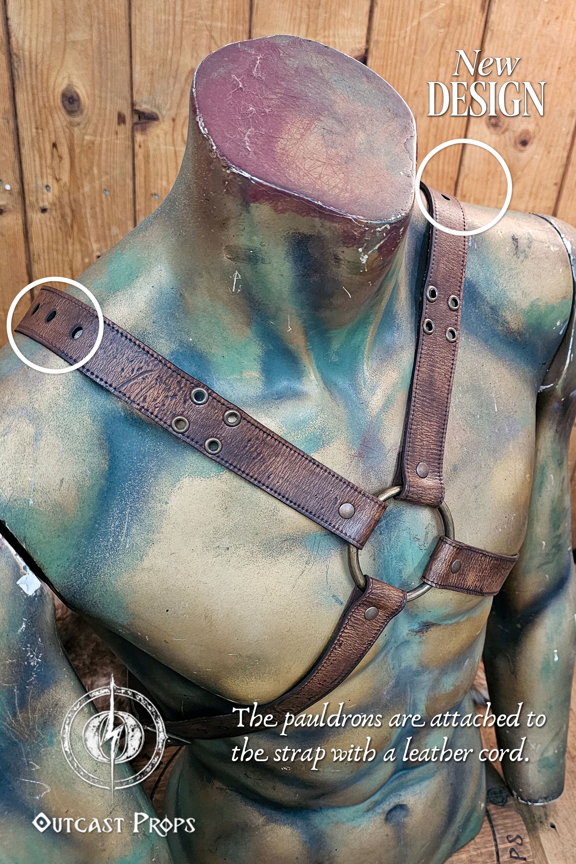 Close-up of the harness system from the Outcast Props pauldron set. The brown vegetable-tanned leather straps cross over the chest and feature reinforced holes for attaching the shoulder armor with a leather cord. This handcrafted design combines Viking and ork influences, built for LARP and cosplay use, highlighting durability, realism, and unique artisan detailing in every piece. Barbarian Leather and Metal Pauldron Set for LARP Viking Warrior Ork Cosplay Armor Shoulder Pads Post Apocalyptic