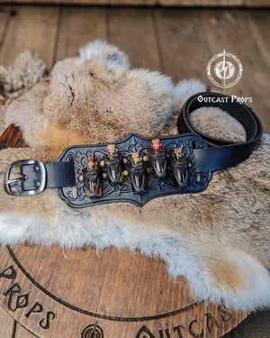 A handmade leather potion holder with ornate embossed patterns, designed to hold five small glass vials. The holder is displayed on a furry surface, and the vials have cork stoppers. Ornated Belt potion holder | 5 potion Belt carrier | LARP, cosplay, fantasy alchemist accessory, adventurers, steampunk, alchemist, healers