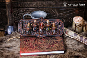 A handmade leather potion holder with ornate embossed patterns, designed to hold five small glass vials. The holder is displayed on a furry surface, and the vials have cork stoppers. Ornated Belt potion holder | 5 potion Belt carrier | LARP, cosplay, fantasy alchemist accessory, adventurers, steampunk, alchemist, healers