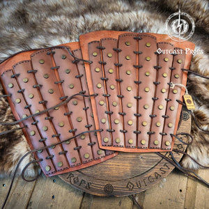 Pair of leather leg guards with metal studs on a fur background. Samurai Leather Greaves for LARP Cosplay or Renaissance Fair Studded Shin Armor Fantasy Warrior Leg Guards Handmade Medieval Costume Piece