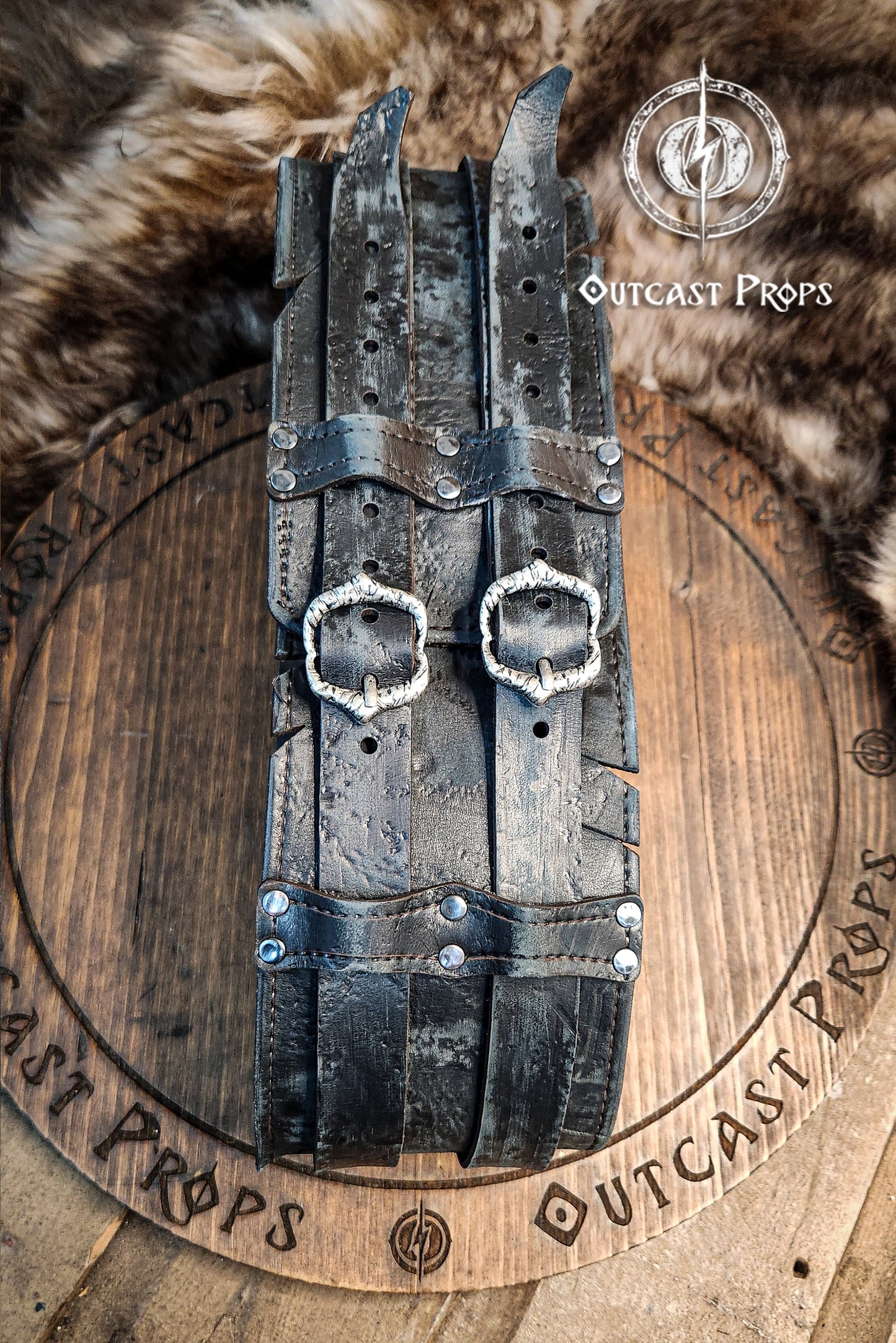 Black doble leather broadbelt with silver buckles on a wooden surface with 'Outcast Props' branding. Veteran Leather Belt. Medieval leather belt. Orc belt. Warrior belt for larp.