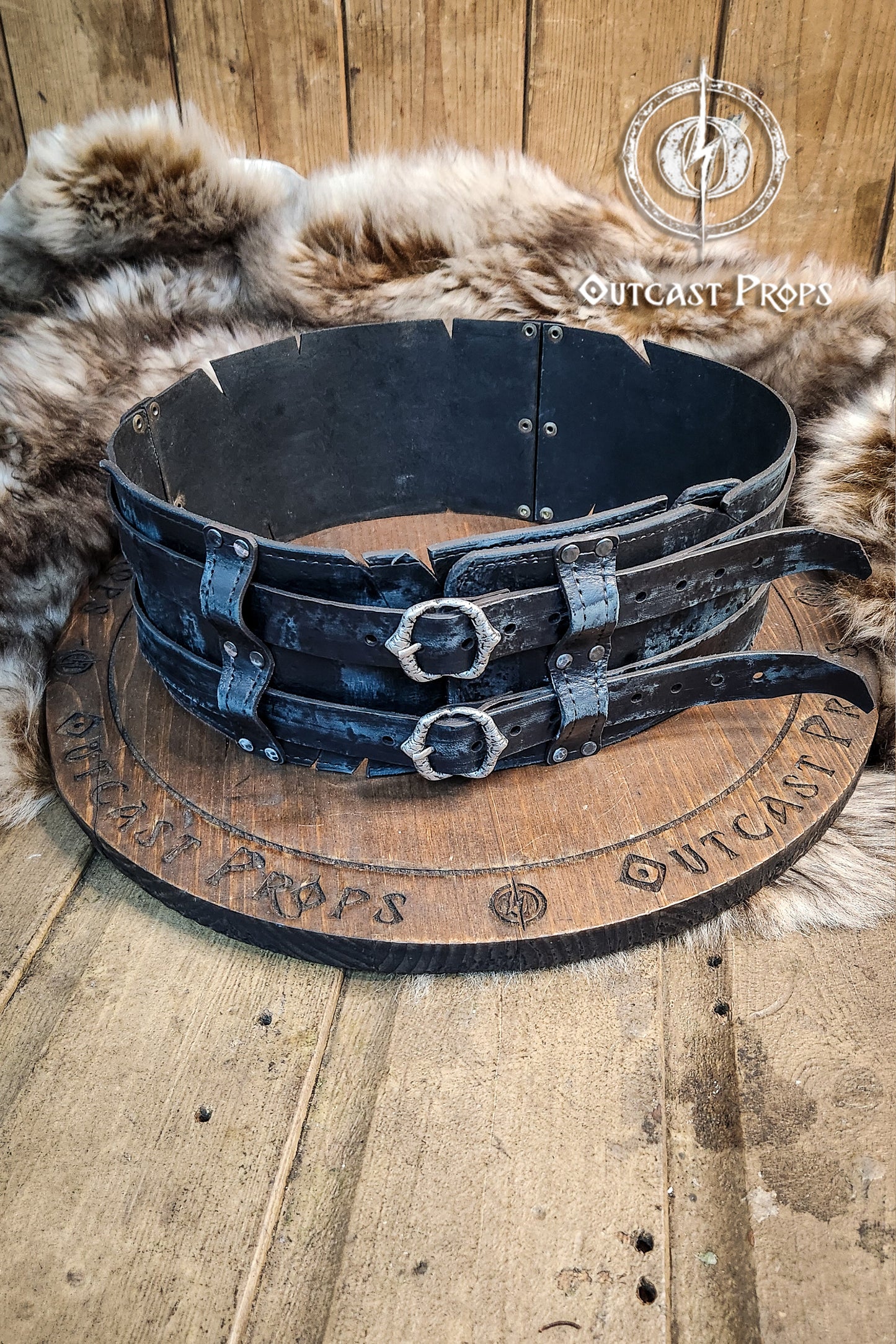 Black doble leather broadbelt with silver buckles on a wooden surface with 'Outcast Props' branding. Veteran Leather Belt. Medieval leather belt. Orc belt. Warrior belt for larp.