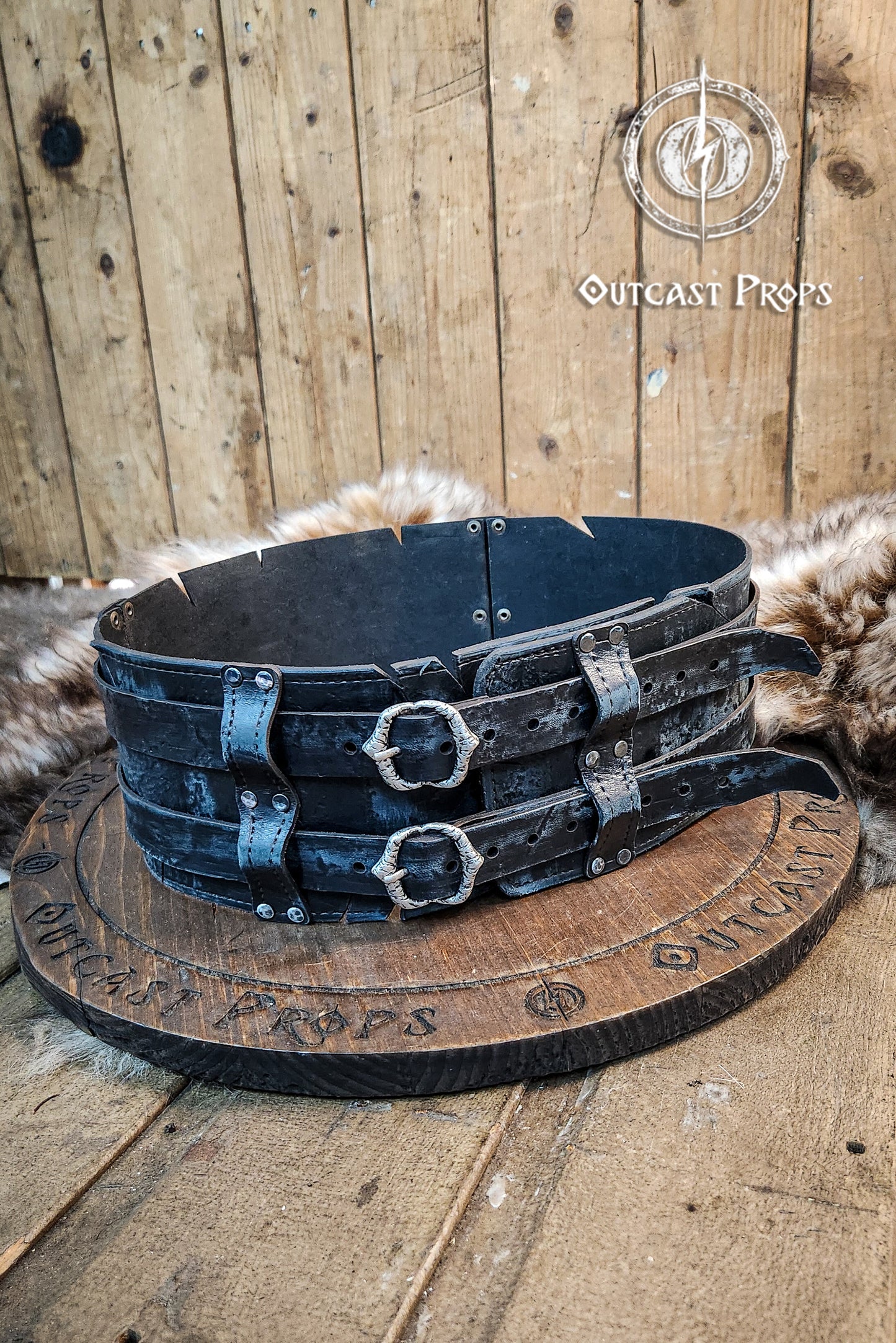 Black doble leather broadbelt with silver buckles on a wooden surface with 'Outcast Props' branding. Veteran Leather Belt. Medieval leather belt. Orc belt. Warrior belt for larp.