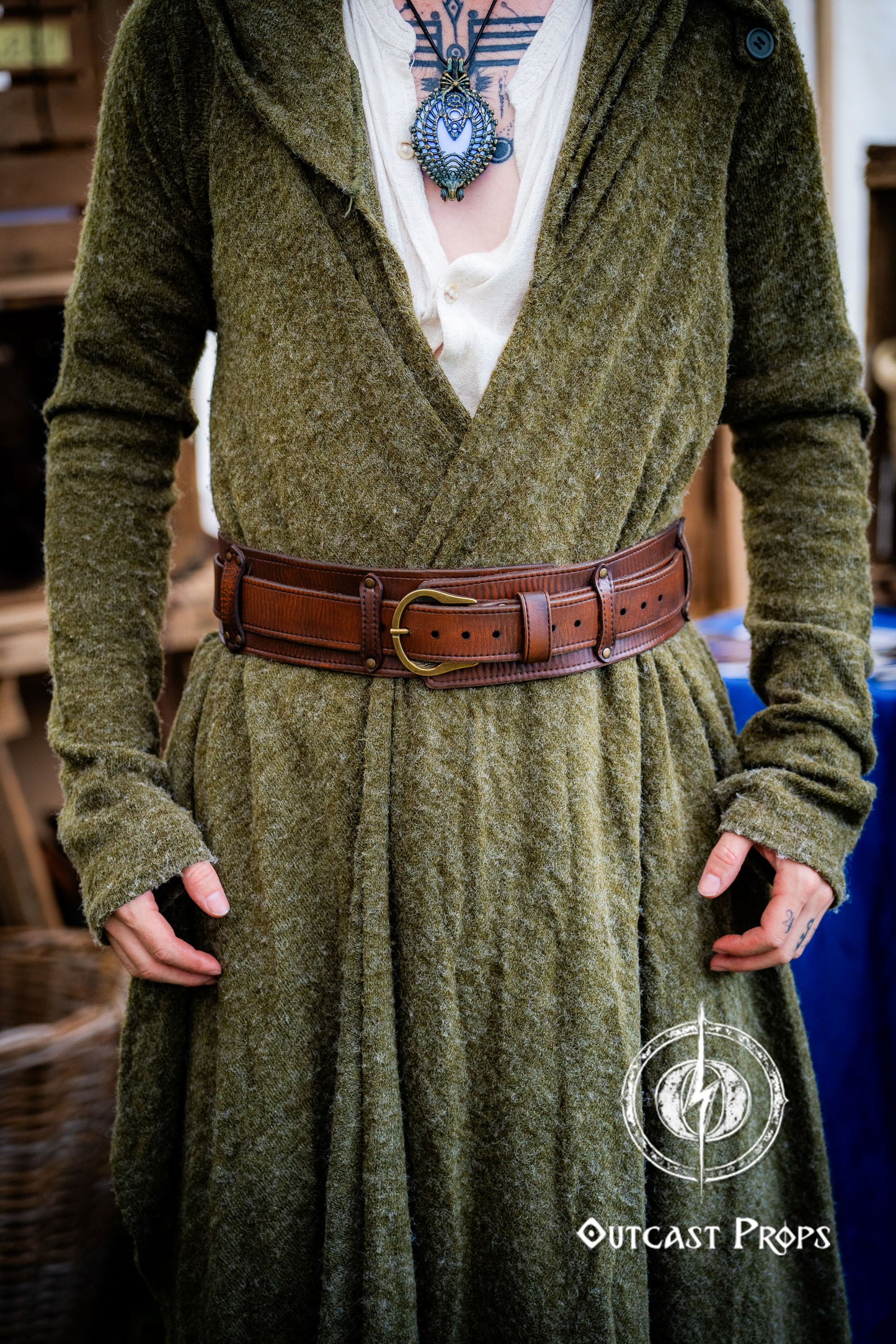 Person wearing a green dress with a brown belt, standing indoors. Celtic knot leather belt silver buckle larp belt for ren fair fantasy costume celtic belt unisex leather belt for renaissance outfit