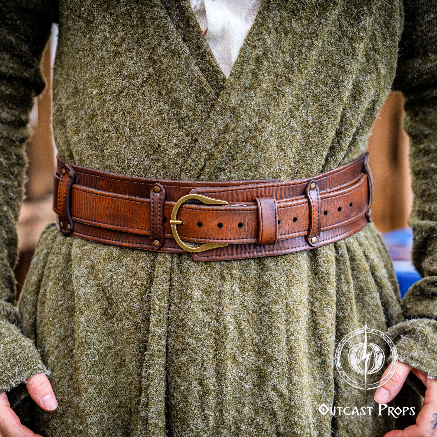 Person wearing a green robe with a brown belt and Outcast Props logo. Celtic knot leather belt silver buckle larp belt for ren fair fantasy costume celtic belt unisex leather belt for renaissance outfit