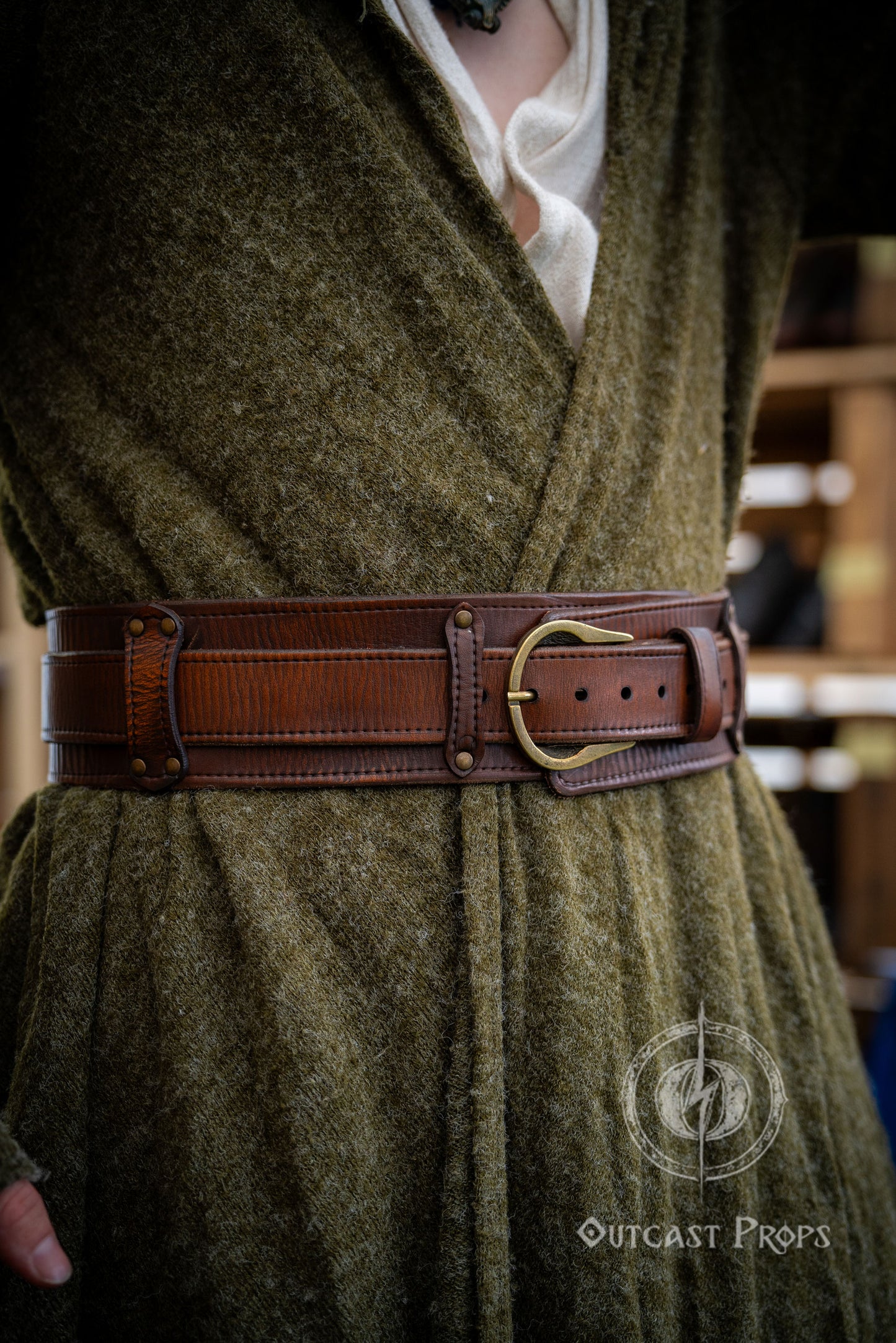 Person wearing a green robe with a brown belt in an indoor setting. Celtic knot leather belt silver buckle larp belt for ren fair fantasy costume celtic belt unisex leather belt for renaissance outfit
