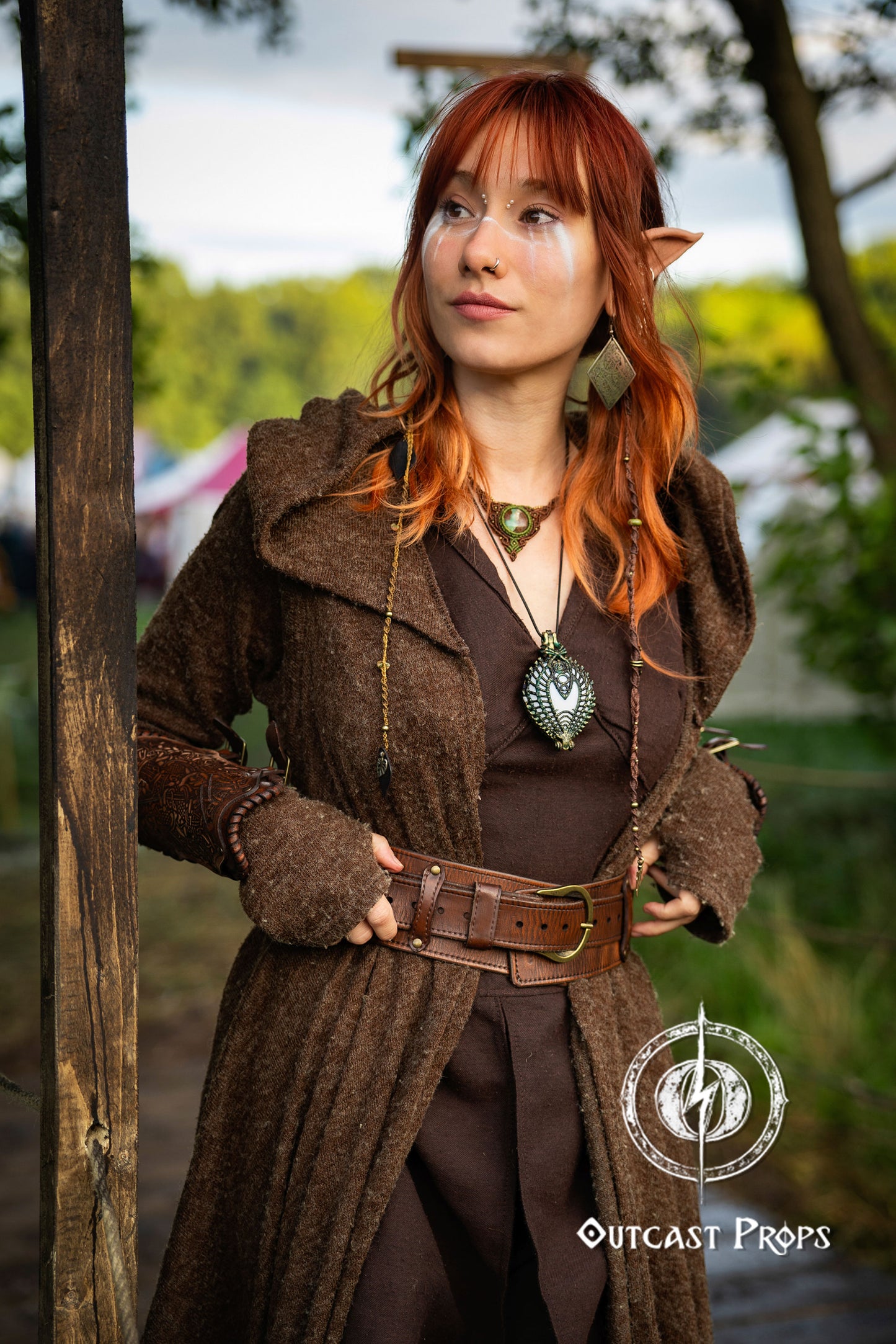 Person in fantasy costume with brown coat and red hair standing outdoors. Celtic knot leather belt silver buckle larp belt for ren fair fantasy costume celtic belt unisex leather belt for renaissance outfit