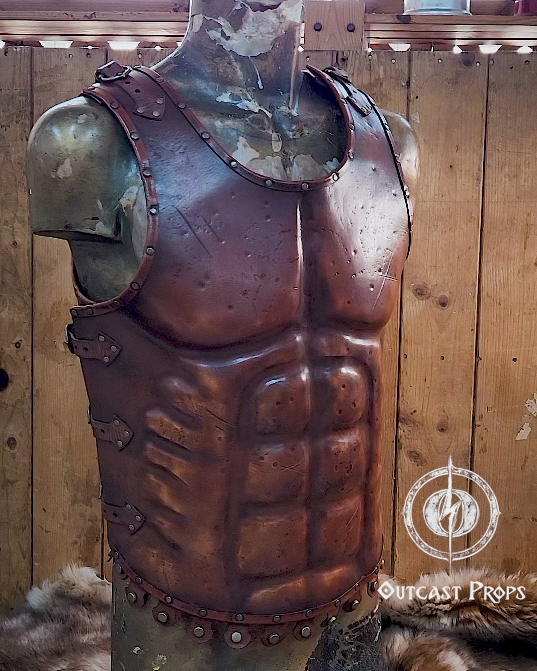 Close-up video of the leather Roman gladiator armor, displaying detailed muscle shaping and battle scratches. This musculata cuirass is ideal for LARP events, cosplay warriors, and reenactment fans. Made with vegetable-tanned leather and hand-riveted accents, it mimics the heroic physique of Roman generals and fantasy heroes with striking realism.