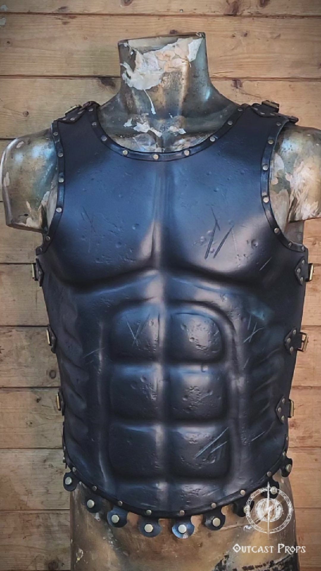 Close-up video of the leather Roman gladiator armor, displaying detailed muscle shaping and battle scratches. This musculata cuirass is ideal for LARP events, cosplay warriors, and reenactment fans. Made with vegetable-tanned leather and hand-riveted accents, it mimics the heroic physique of Roman generals and fantasy heroes with striking realism.