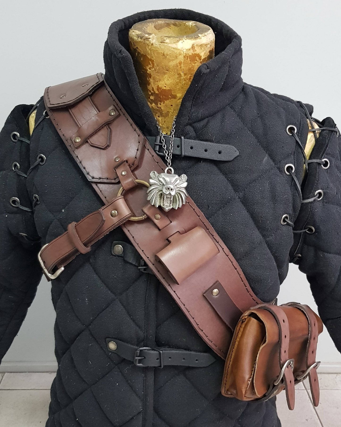 Witcher leather baldric worn with wolf medallion, showing front details and pouch attachment. Premium Witcher 3 ursine armor cosplay piece, Geralt costume accessory, leather baldric for LARP, bear school monster hunter gear, and Witcher RPG builds.