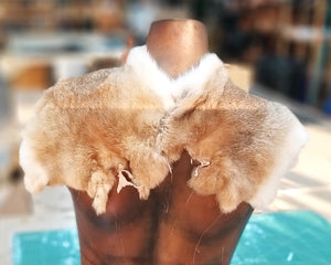 Rustic brown Viking fur mantle on display over a female torso. Made from soft, warm fur with white accents and a brown leather clasp in Nordic style. Perfect for medieval LARP, Celtic costumes, fantasy cosplay or Viking roleplay. A handmade shoulder cape that adds realism and warmth to tribal outfits. Great for female warrior characters, shieldmaidens, or hunters in historical reenactment.