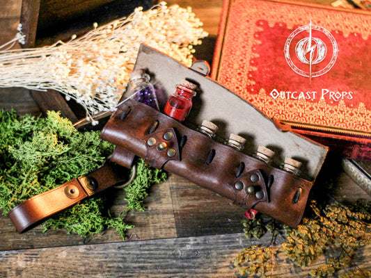 6 Small Potion leather case, vertical belt kit for LARP, Cosplay and Costume. Easily Carry six strong cristal bottle with corkce, featuring 'Outcast Props' branding.