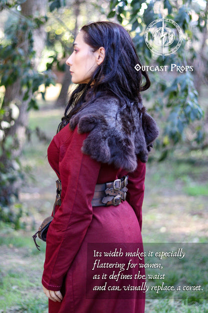Adventurer Leather Belt for LARP, Pirate Belt, Alchemist Belt, Medieval Belt, Fantasy, Steampunk, Wide Leather Belt, Adjustable Belt. Person wearing a red coat with fur trim in a forest setting, branded 'Outcast Props'. 