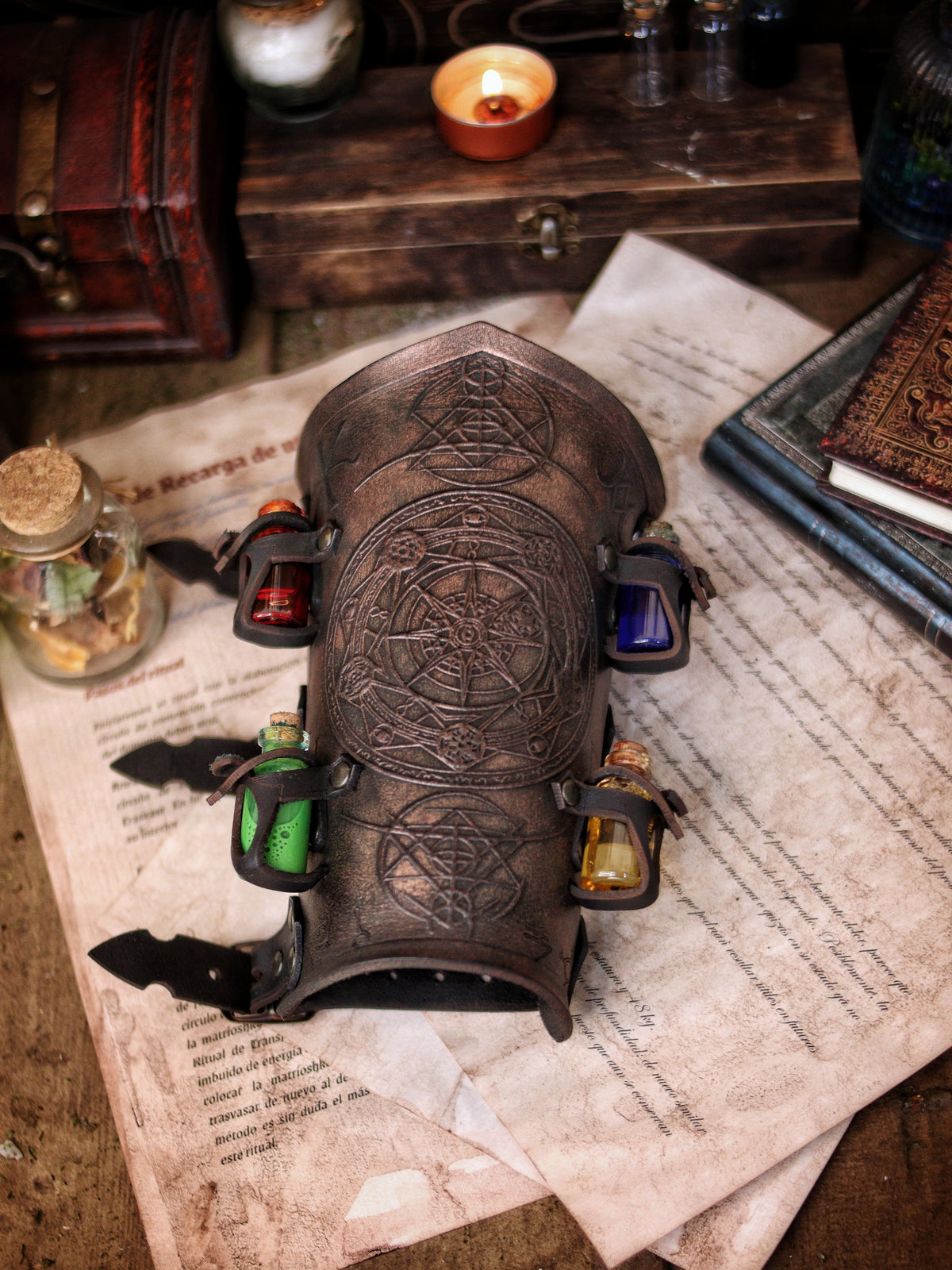 A leather bracer with metal rivets and straps, featuring intricate alchemical circles and small glass vials for storing liquids. Alchemist leather bracer with transmutation circle larp armor Wizards sorcerers and masters of the occult and the arcane