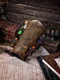A leather bracer with metal rivets and straps, featuring intricate alchemical circles and small glass vials for storing liquids. Alchemist leather bracer with transmutation circle larp armor Wizards sorcerers and masters of the occult and the arcane