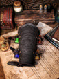A leather bracer with metal rivets and straps, featuring intricate alchemical circles and small glass vials for storing liquids. Alchemist leather bracer with transmutation circle larp armor Wizards sorcerers and masters of the occult and the arcane