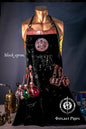 Black apron with decorative elements on a mannequin against a dark background, featuring 'Outcast Props' branding.