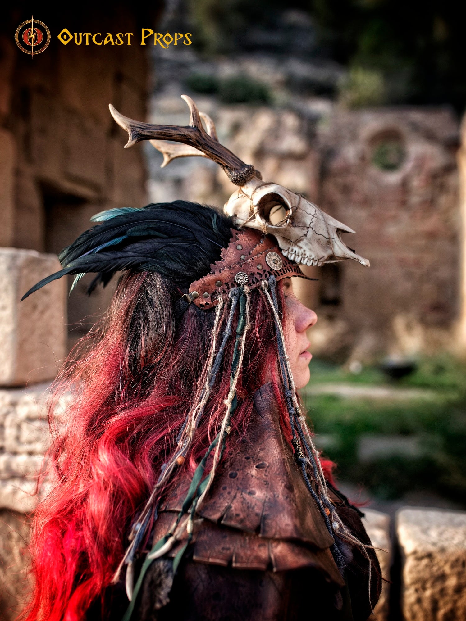 A Celtic adorned tiara with a resin skull, deer horns, feathers, bone pieces, beads, and fangs. Beltane Headpiece tribal deer horns skull and feathers tiara leather and resin