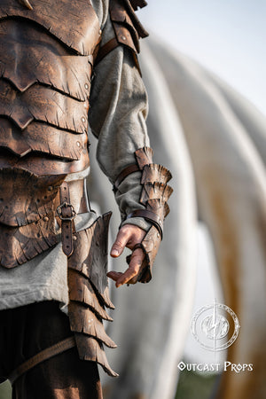 Dragon Scale Leather Bracer: LARP Cosplay Armor for Fantasy Warriors, Orcs, Archers - Handmade Medieval Costume Close-up of a person wearing detailed armor with a blurred background