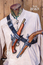Full frontal display of the Edward Kenway style leather baldric, worn diagonally over a natural linen shirt. The black vegetable-tanned leather strap supports two flintlock replicas, held in place by detailed metallic clips. With pirate aesthetics inspired by historical and fantasy fiction, this LARP baldric adds authenticity to any Ren Faire outfit or rogue character ensemble.