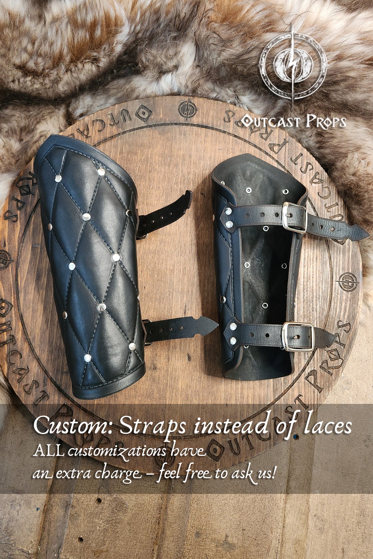 Pair of black leather arm guards on a wooden background with Outcast Props branding. Falken leather bracers for noble costume LARP outfit medieval fantasy accessories for Ren Faire cosplay arm guards for knight character gear