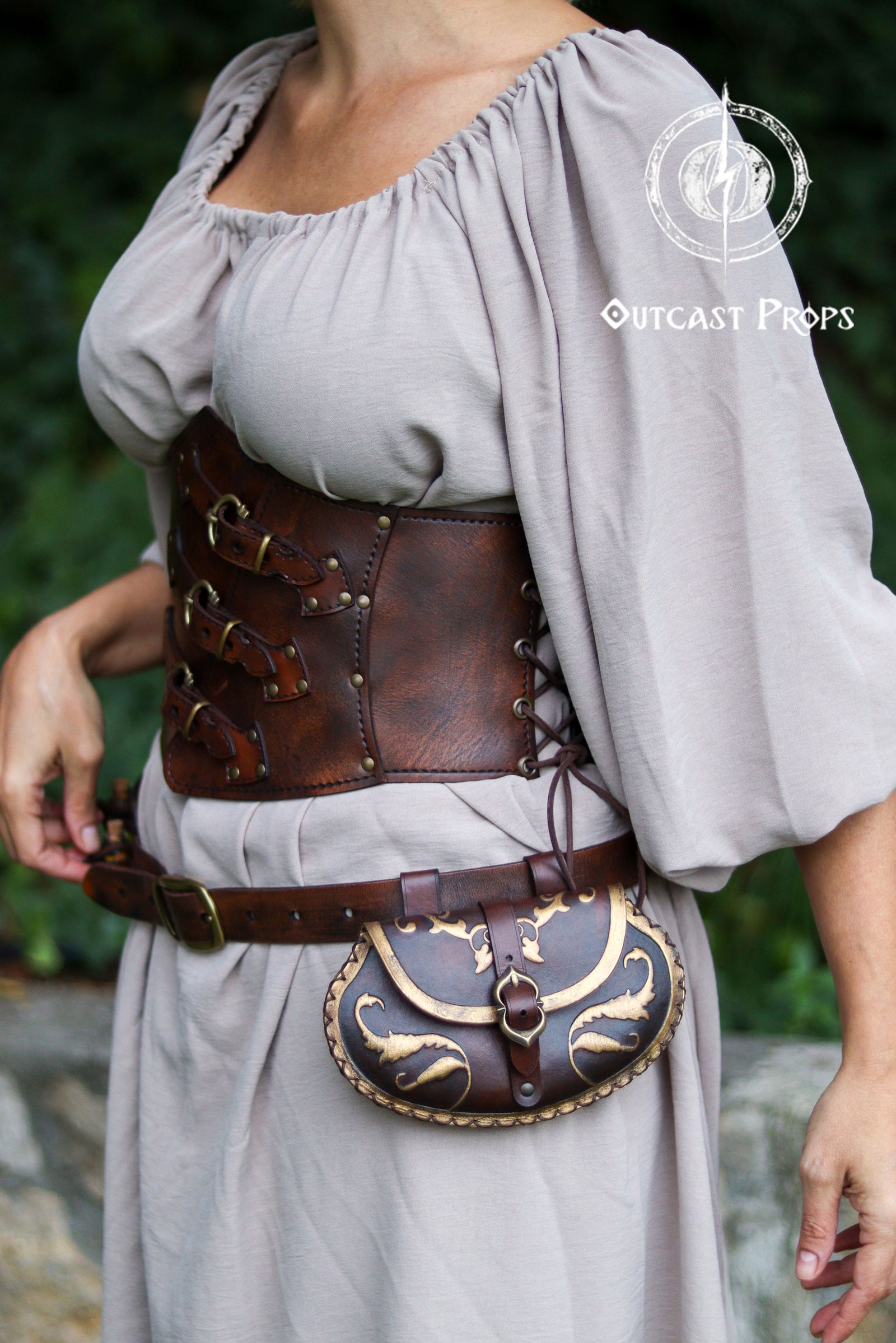 Person wearing a brown leather corset and matching pouch. Pear Shape Leather Pouch Small renaissance belt bag for larp cosplay noble costume accessory handmade vegetable tanned leather