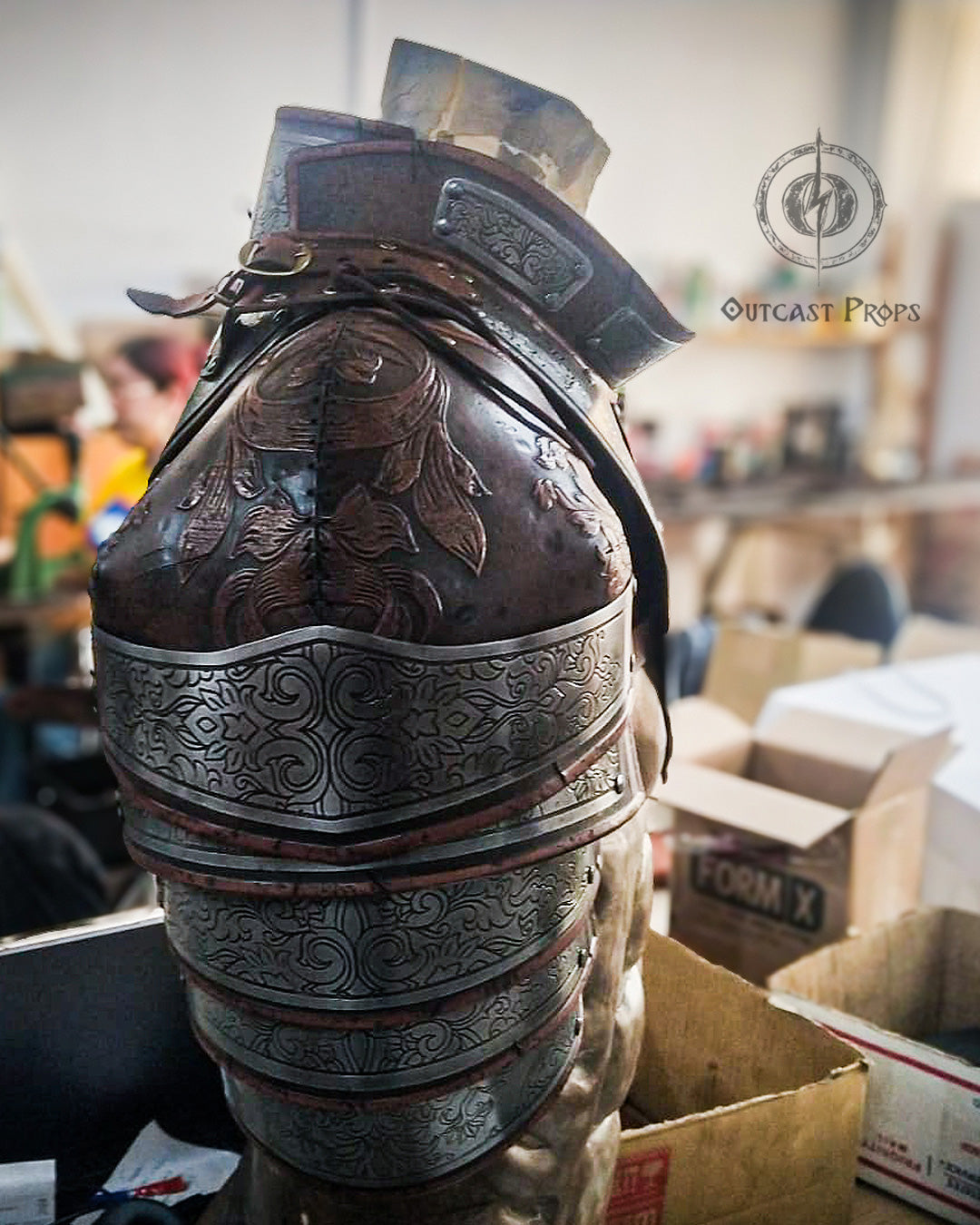 Front of the custom gorget with scrolling engraved metal panels