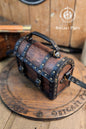 Wooden barrel-shaped bag with leather straps on a wooden surface, branded 'Outcast Props'. Leather treasure chest pirate chest bag larp pirate backpack treasure chest purse pirate accessories cosplay renfaire pouch belt bag
