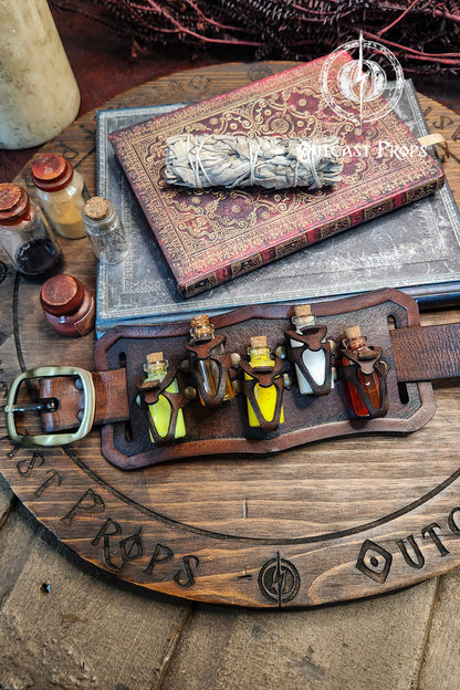 Brown belt with small bottles and a book on a rustic surface. Belt Potion holder for 5 small bottles. Made of leather for adventurers, steampunk, alchemist, healers, cosplay or just to keep spices