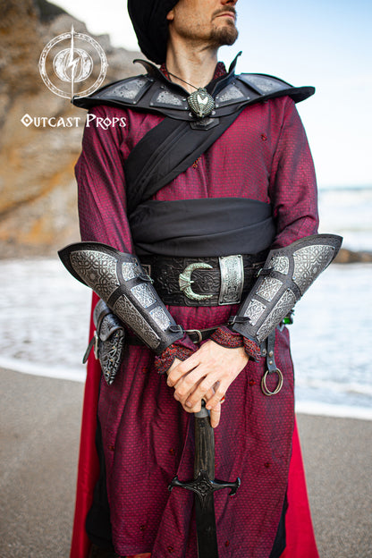 Person in medieval costume with armor and sword on a beach, Ramattush Persian Leather Broadbelt, ornamental Arabic and Persian courts inspired, larp oriental leather belt, fantasy belt, renfaire belt. Jafar cosplay costume. Aladdin cosplay.