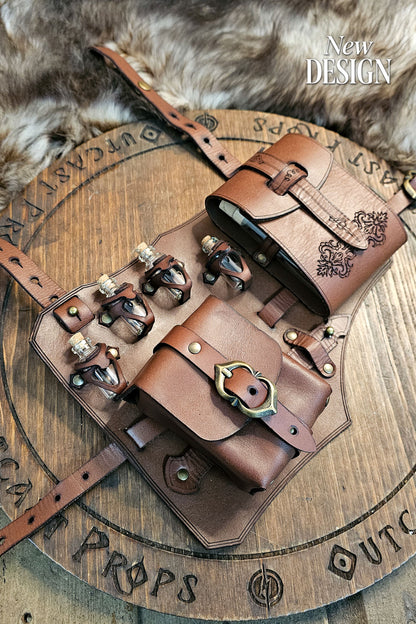 Top view of the brown leather leg holster placed on a wooden Outcast Props board with fur background. Features two pouches, four potion vials in handmade leather holders, brass buckles, and embossed floral details. Crafted from full-grain vegetable-tanned leather, this fantasy accessory for LARP, cosplay, and renaissance fairs blends artisan craftsmanship, adjustability, and authentic medieval adventure design.