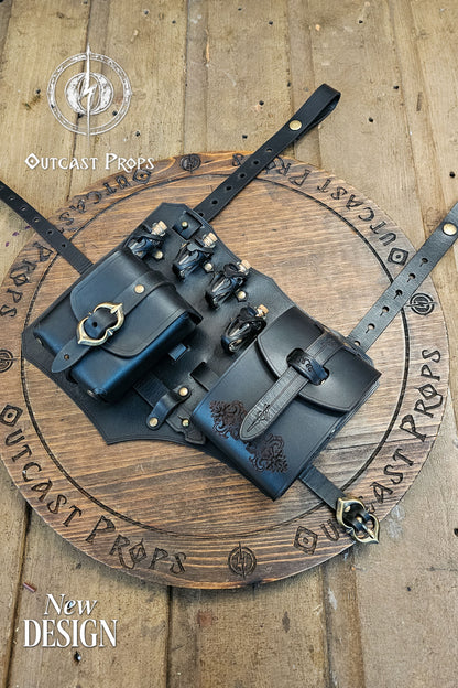 Detailed close-up of the black leather potion holster with two pouches, glass vials, and antique brass hardware. Floral embossing on the larger pouch adds character. Handcrafted by Outcast Props using vegetable tanned leather, hand dyed and aged. Designed for rogues, alchemists, and LARP players, it blends functionality, comfort, and fantasy realism for immersive medieval or cosplay outfits. Adjustable straps keep gear steady. Smooth edges and reinforced rivets add comfort, durability at events.