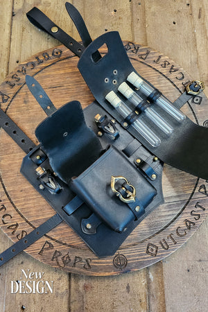 Full view of the rogue leather leg holster showing modular layout, adjustable straps, and a detachable leg belt to wear over a tunic or skirt. Features potion vial loops, two pouches and brass buckles. Handmade by Outcast Props from premium vegetable tanned leather for LARP, cosplay, and renaissance fairs, offering versatility and secure carry for alchemists, rogues, and adventurers. Wear it on belt or thigh for access. Smooth edges and reinforced rivets add comfort and durability at events too