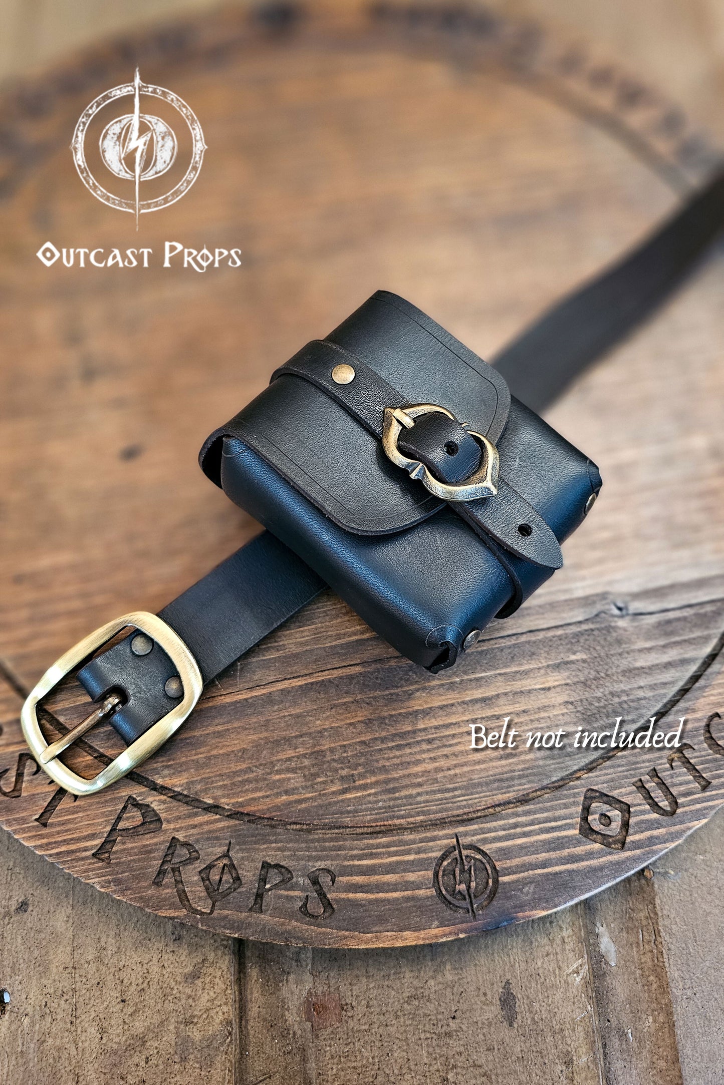 Tavern Small Leather Belt Pouch for Daily Wear LARP Renaissance Fair Viking Cosplay Medieval Accessory Steampunk Coin or Tobacco Pouch. Black leather pouch with gold buckle on a wooden surface, branded 'Outcast Props'.