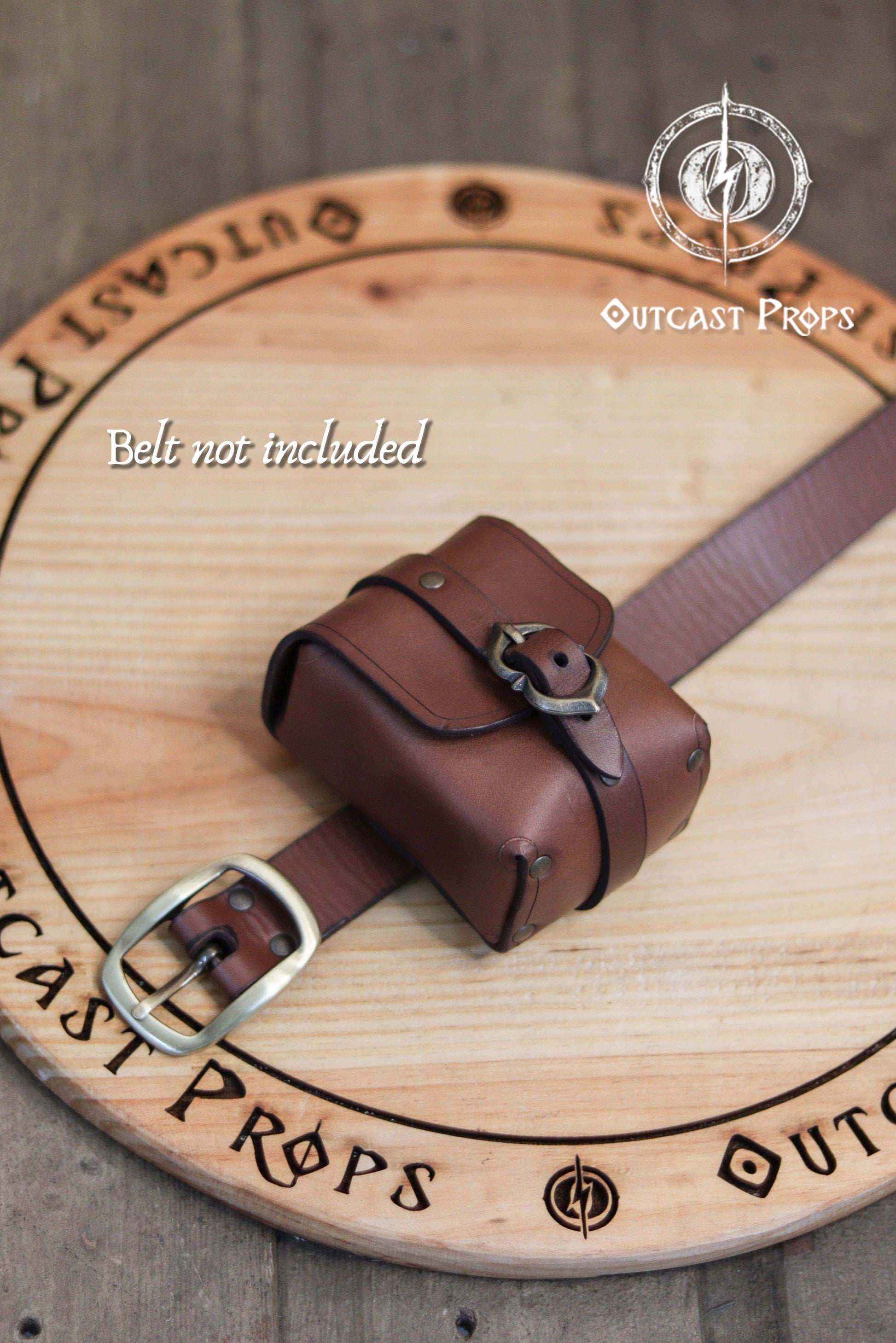 Tavern Small Leather Belt Pouch for Daily Wear LARP Renaissance Fair Viking Cosplay Medieval Accessory Steampunk Coin or Tobacco Pouch. Brown leather belt with buckles on a wooden surface with 'Outcast Props' branding.