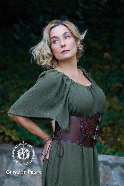 Woman wearing a green dress with a brown belt against a natural background. Elegant Floral Underbust Leather Corset - Handcrafted Rose Design for Larp, Reinassande Faire &amp; Cosplay